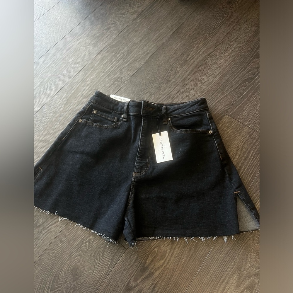 “Weworewhat” black Jean shorts.